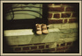 child-shoes-stone-ledge-brick-wall-found-object-film-w2b - tirage encadre